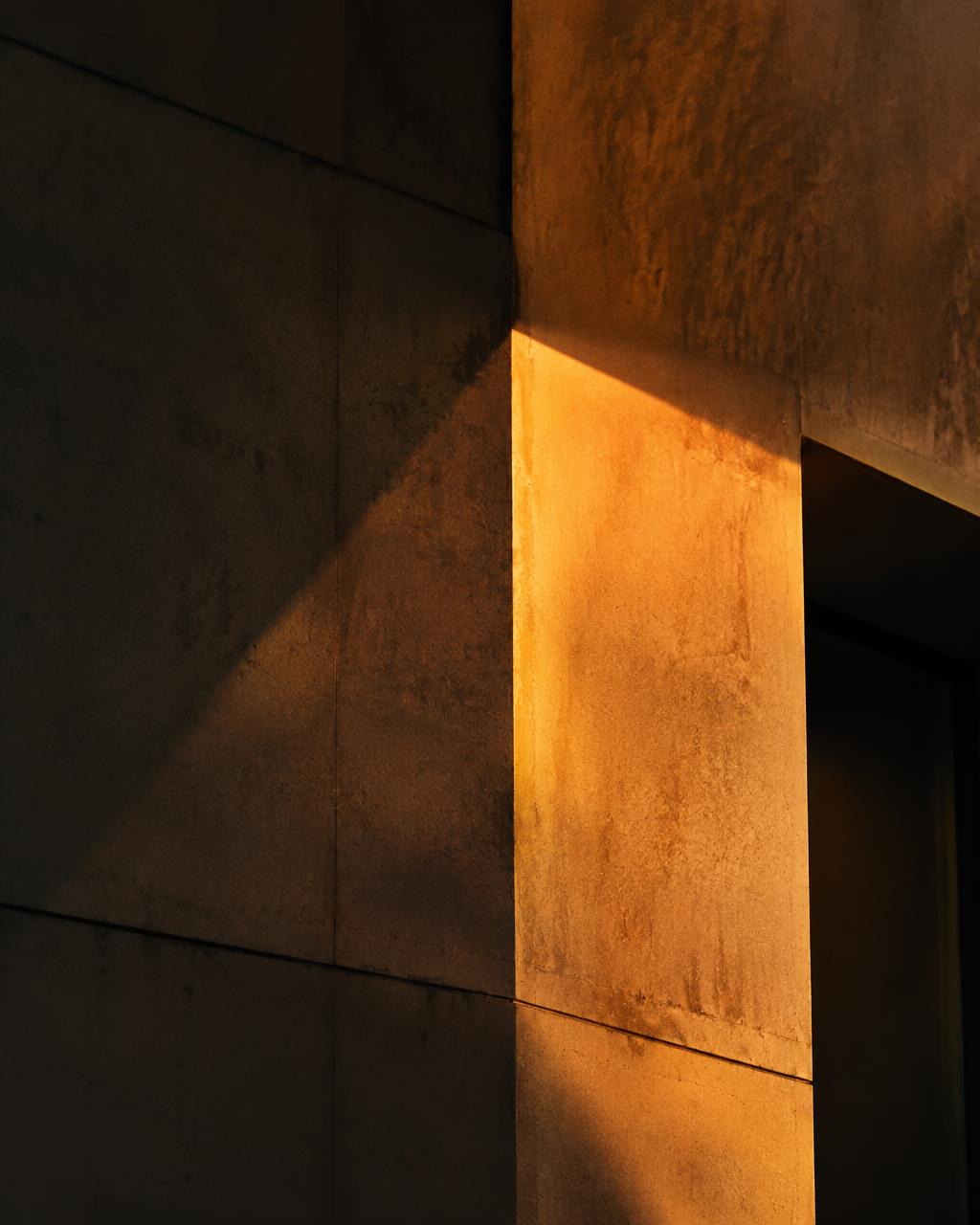 Late sunlight falling across a concrete corner